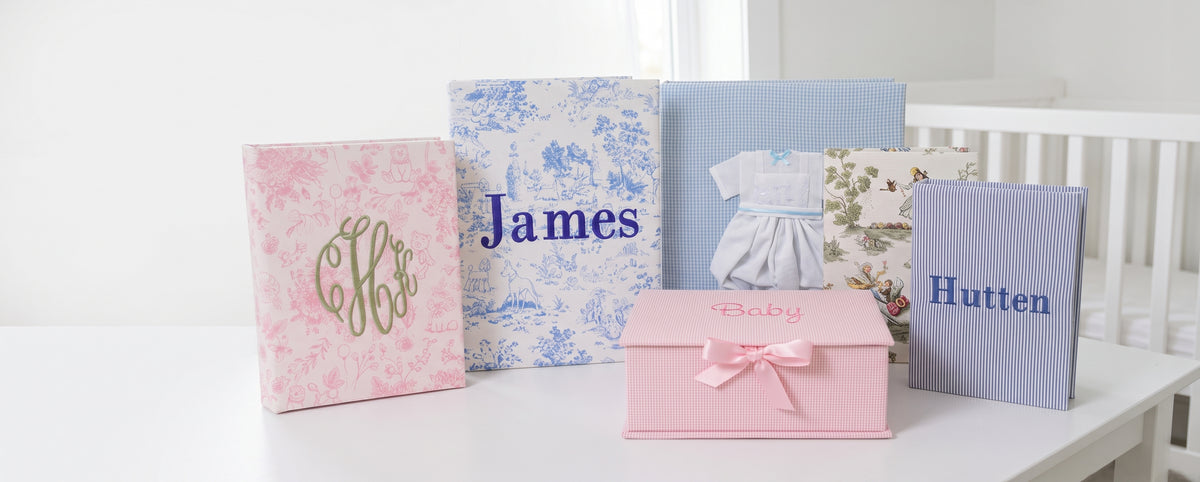 Marcela Gifts heirloom baby keepsakes: embroidered photo albums in toile, check and seersucker, with a pink keepsake box