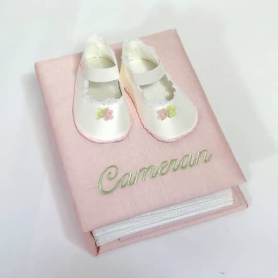 Small Hardbound Photo Album In Silk With Baby Shoes