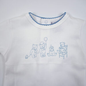 White long-sleeve baby gown made of soft Pima cotton, featuring stitching along the collar and cuffs and a delicate design of teddy bears and toys across the chest. The gown has an elastic hem for easy diaper changes.