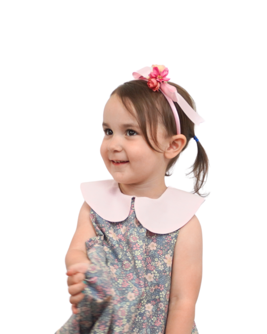 little girl wearing bubble dress gray garden