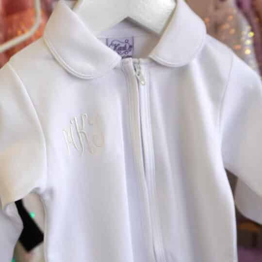 White Pima cotton baby footie with Peter Pan collar and front zipper.