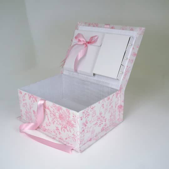 Medium baby keepsake box in Beary Blossoms Toile print, wrapped in pink floral cotton fabric, shown open with a bow accent.