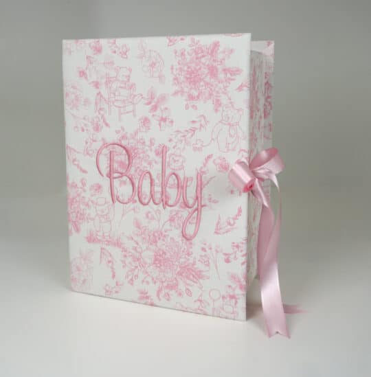 Medium baby keepsake box in Beary Blossoms Toile print, wrapped in pink floral cotton fabric, shown closed with a bow accent.
