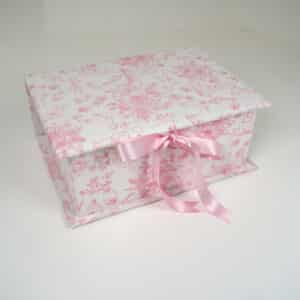 Medium baby keepsake box in Beary Blossoms Toile print, wrapped in pink floral cotton fabric, shown closed with a bow accent.