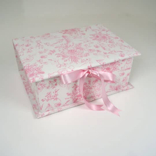 Medium baby keepsake box in Beary Blossoms Toile print, wrapped in pink floral cotton fabric, shown closed with a bow accent.